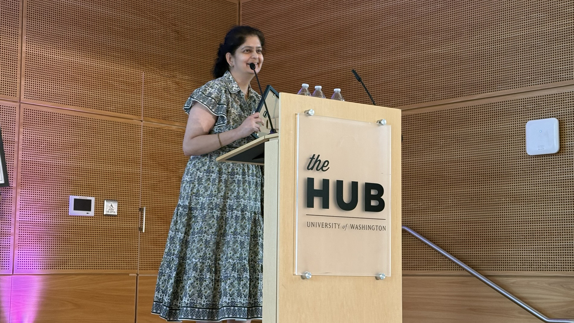 A woman speaks at a podium.
