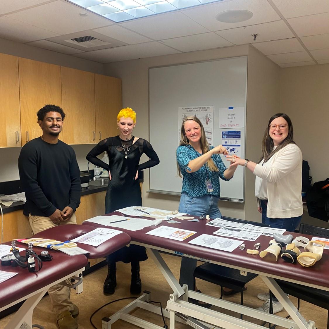 4 students demonstrating splinting