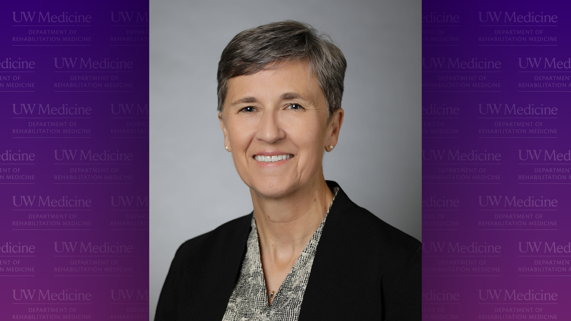 A photo of Dr. Carolynn Patten, surrounded by purple panels. 