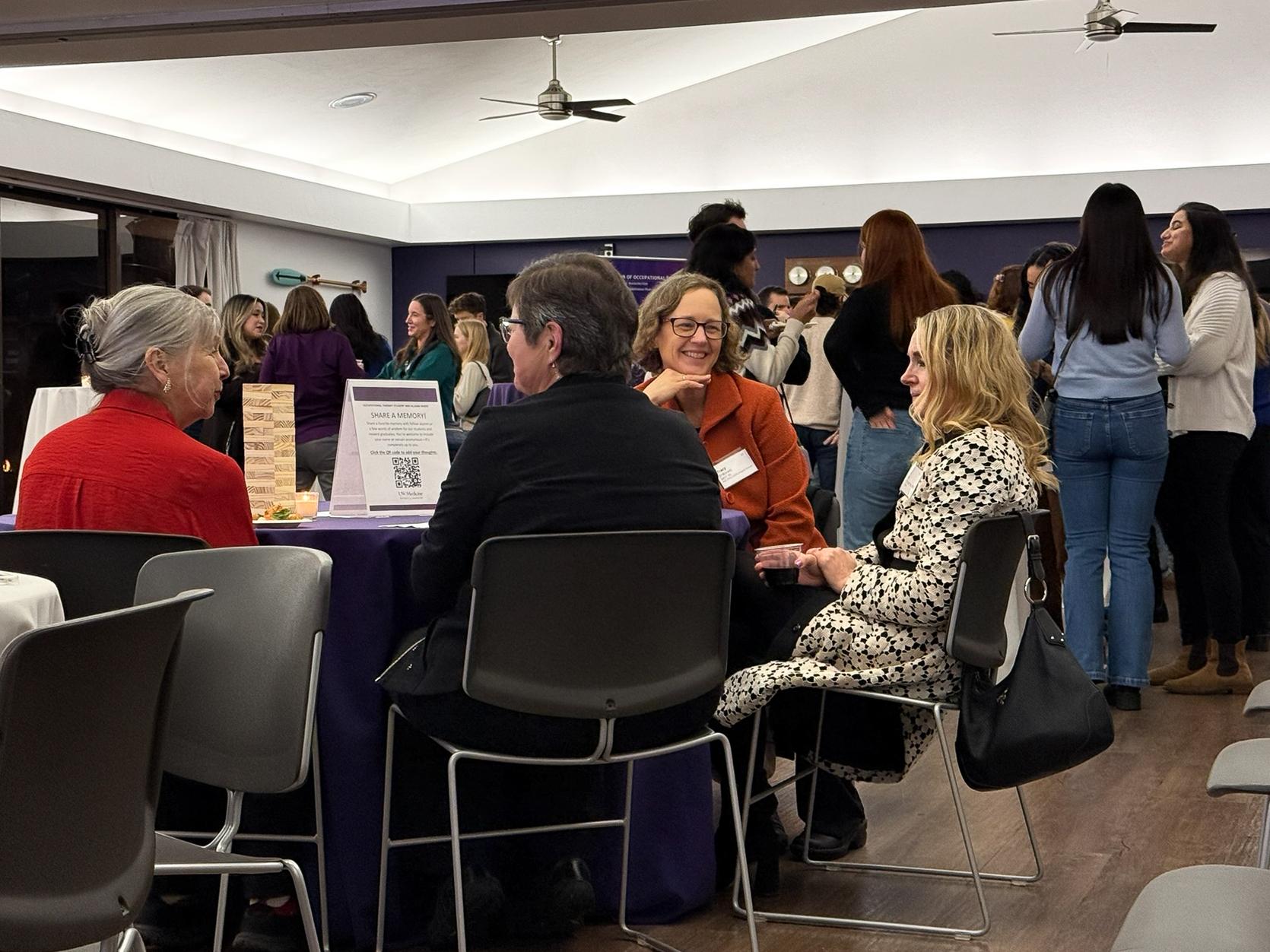 People talk together at a party. 
