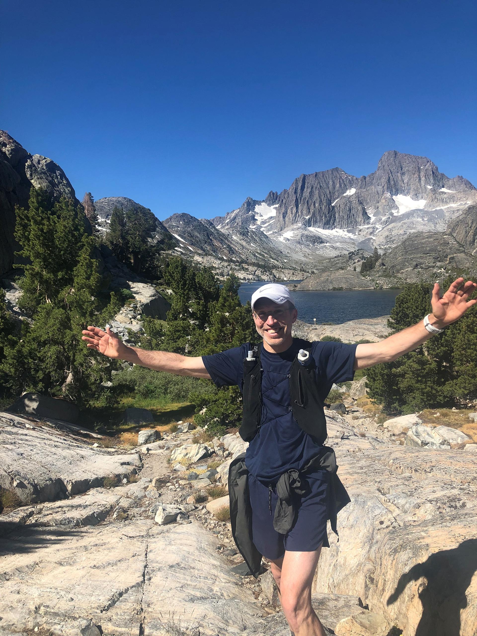 Mark Harrast trail running through a beautiful alpine environment. 