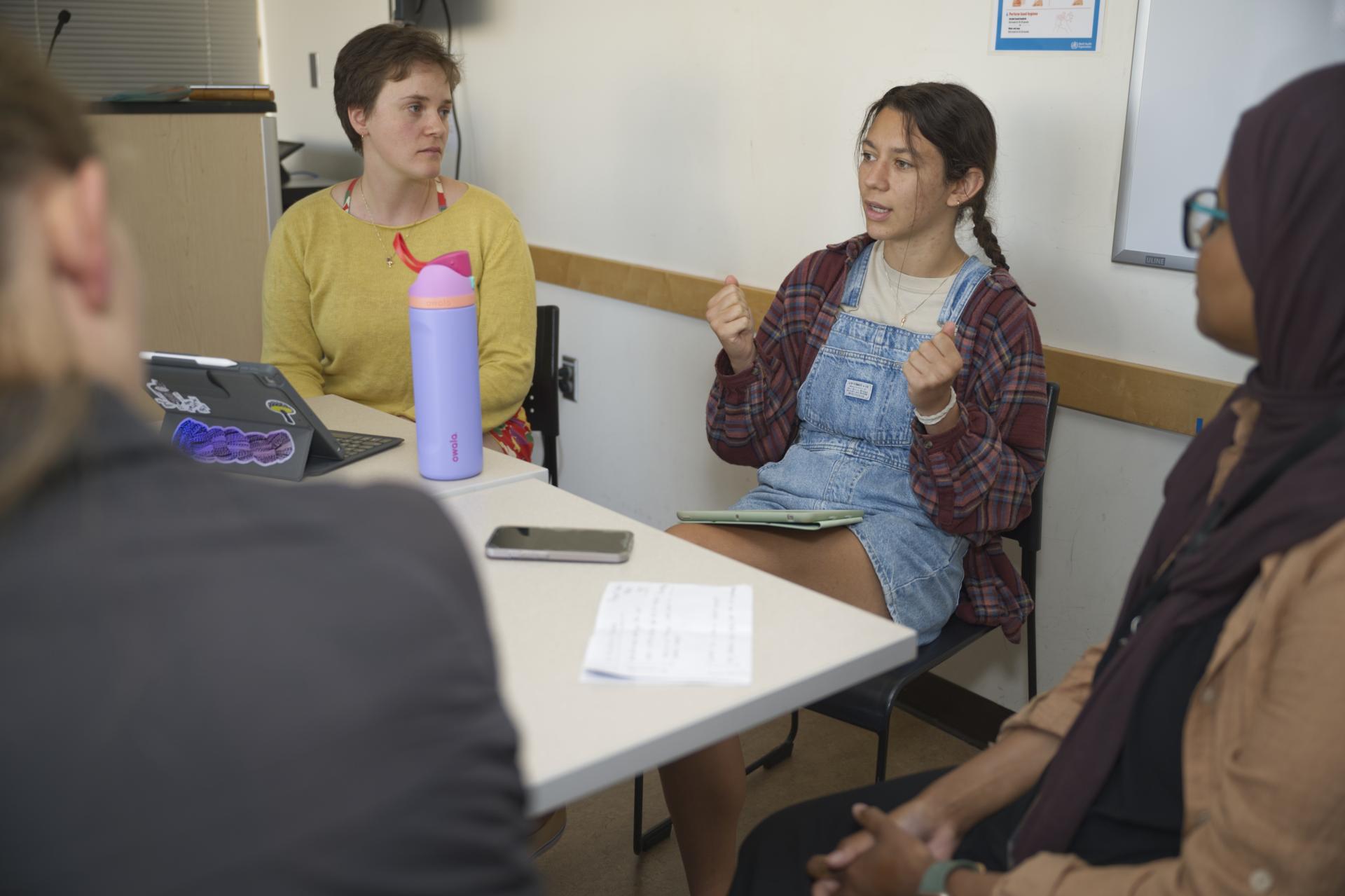 OT students speaking around a table