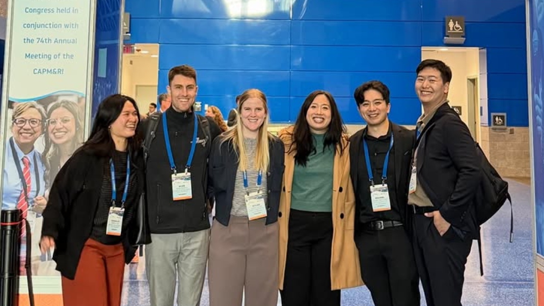 A group of people smiling at the camera.