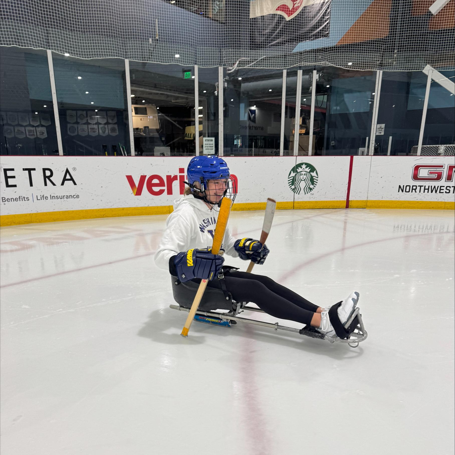 A sled hockey athlete on the ice.