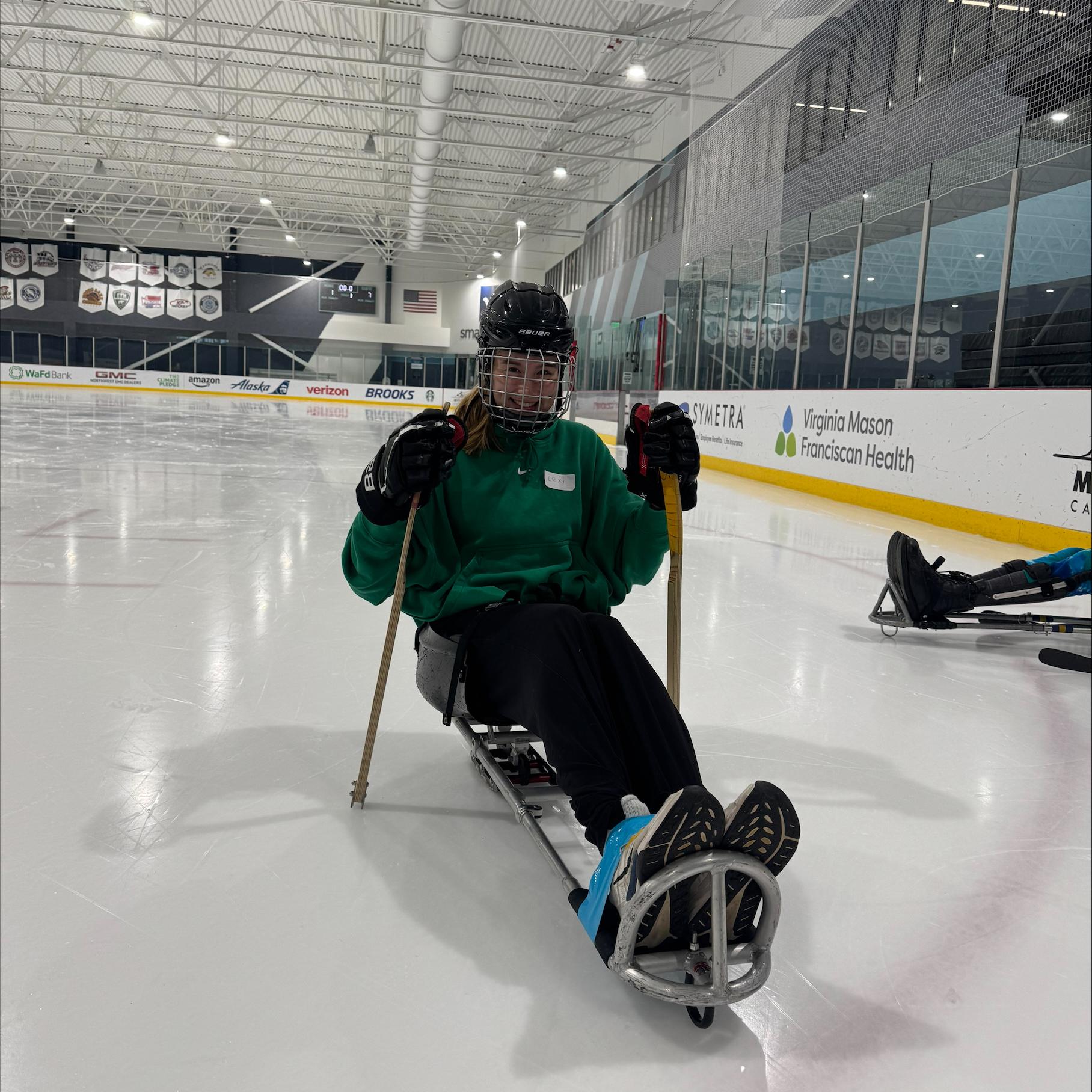 A sled hockey athlete on the ice.